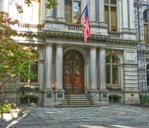 A picture of Boston's Old City Hall, focused on the brown entry doors. Photo by Pascal Bernardon on Unsplash